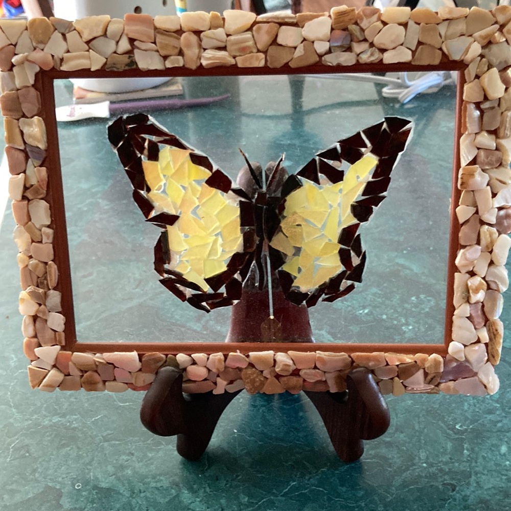 Glass art butterfly with shell decorated frame with stand.